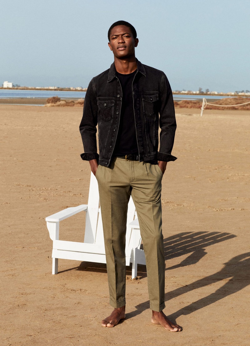 Pleated trousers easily dress up a black Mango jean jacket as worn by Hamid Onifade.