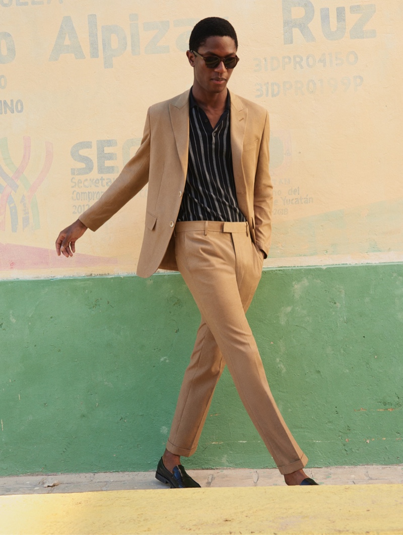 Donning a tan suit, Hamid Onifade stars in Mango's spring-summer 2020 campaign.