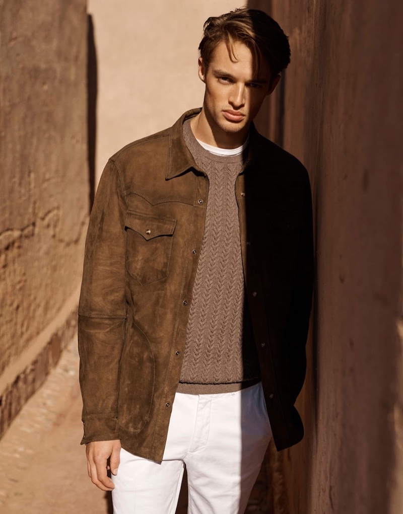 Embracing shades of brown, Morton Nielsen wears a suede shirt jacket with a cable-knit sweater.