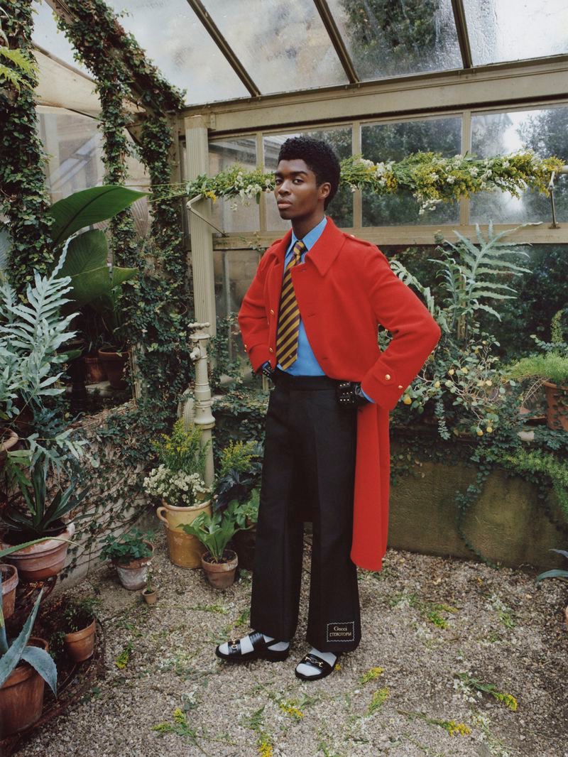 Standing out in a red coat, Alton Mason models Gucci for Nordstrom.