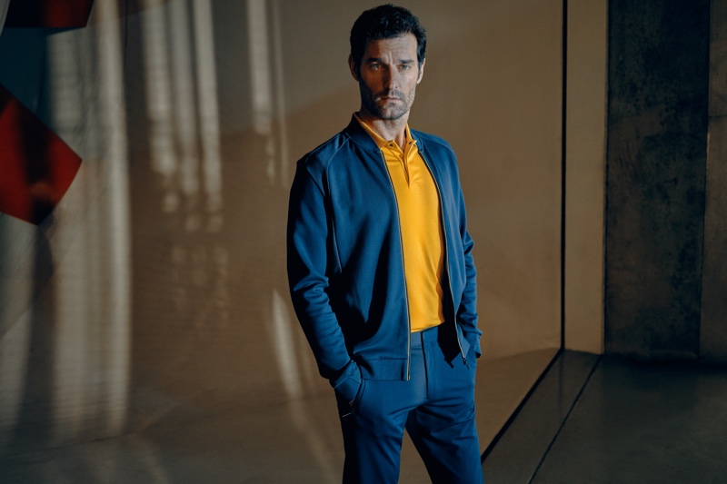 Embracing blue and yellow, Mark Webber fronts the Porsche x BOSS spring-summer 2020 campaign.