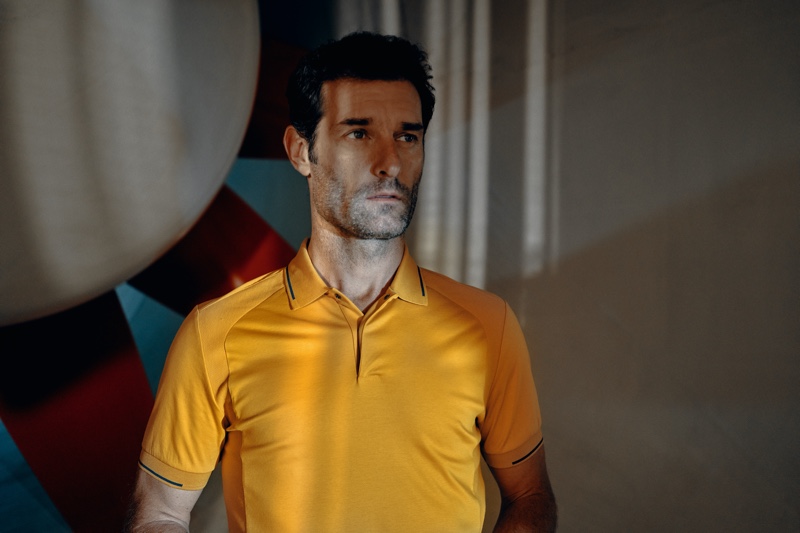 Sporting a yellow polo shirt, Mark Webber appears in the Porsche x BOSS spring-summer 2020 campaign.