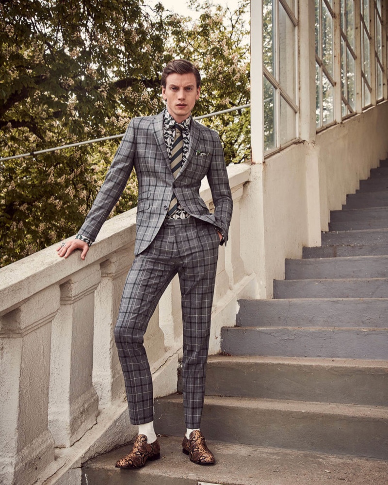 Donning a checked suit, Sid Ellisdon wears Savile Row by CG.