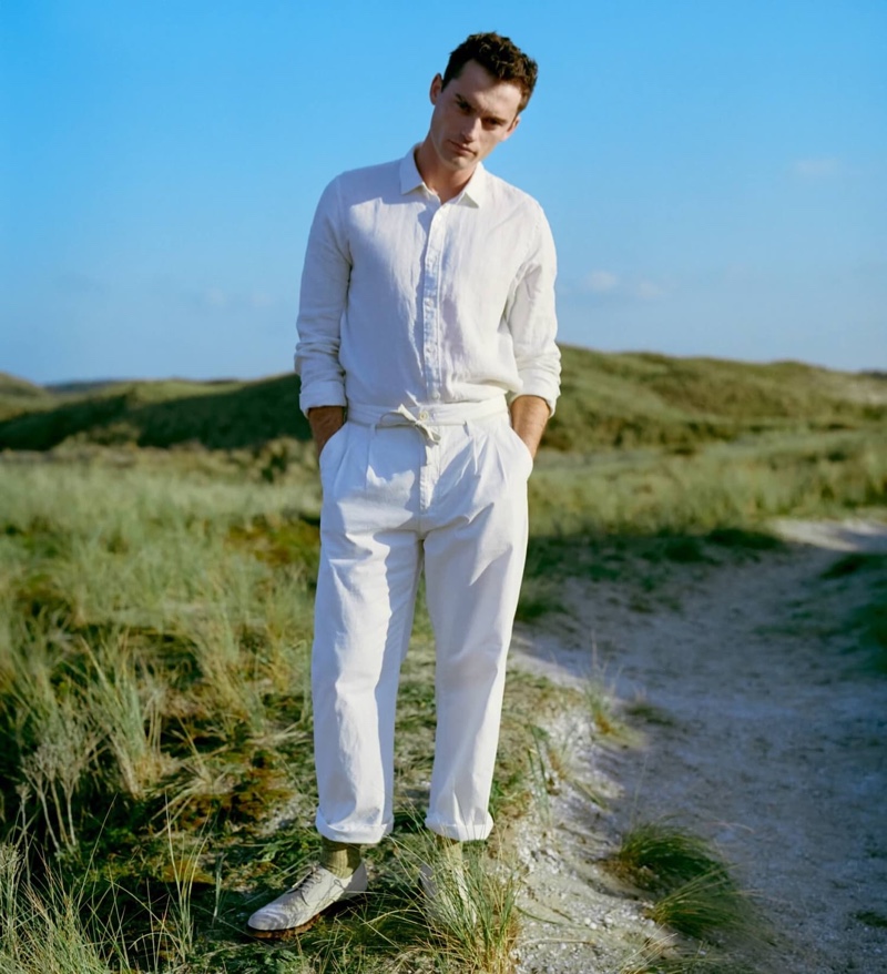 Harrison Griffiths dons a linen shirt with loose tapered fit pleated chinos from Scotch & Soda.