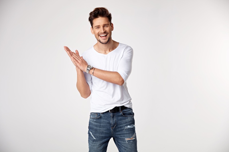 Smiling Male Model Forma Fitting White Shirt Distressed Jeans