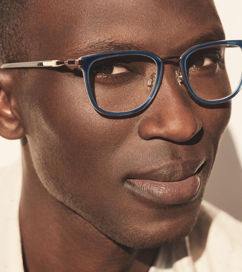 A smart vision, Armando Cabral dons Lovell glasses in indigo crystal with polished gold.