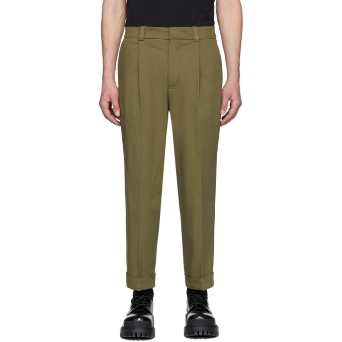 green tapered trousers