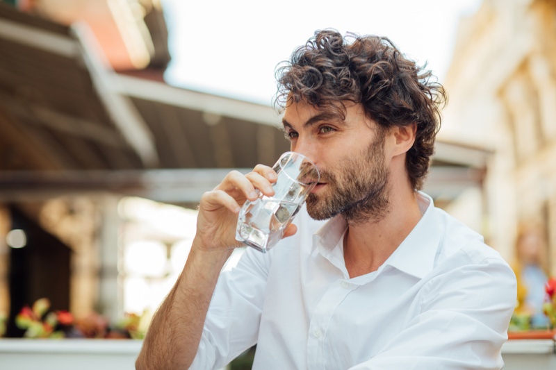 Attractive Man Drinking Water Curly Hair