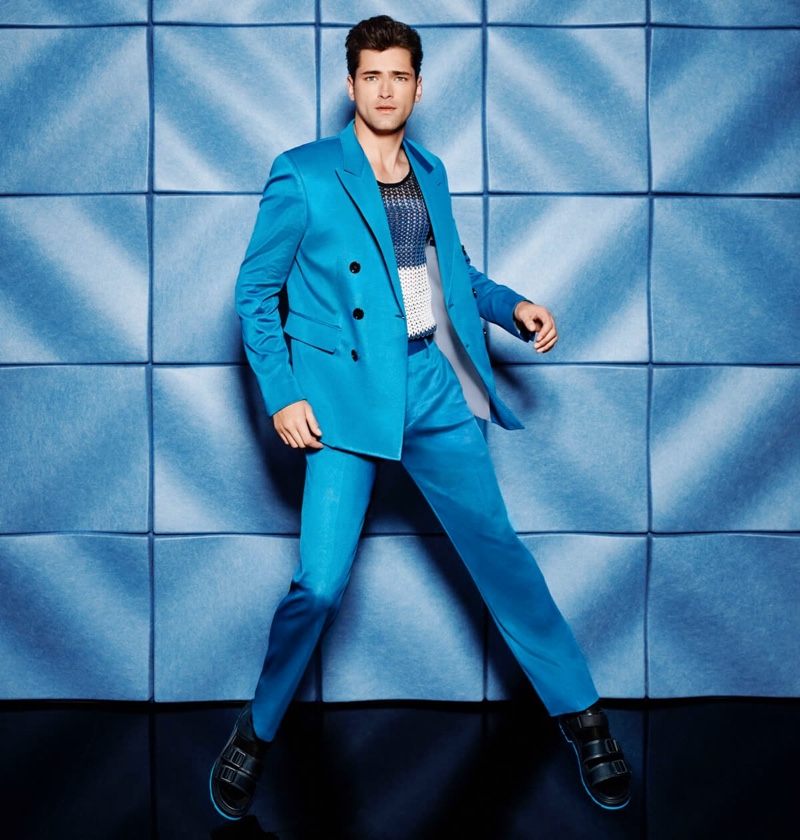 Standing out in blue, Sean O'Pry dons a jersey double-breasted suit with a t-shirt by BOSS for Holt Renfrew.