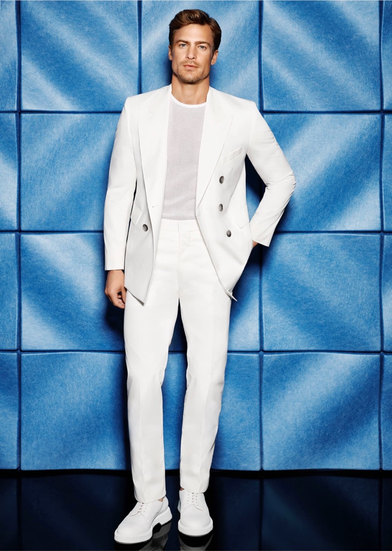 A clean summer vision, Jason Morgan models a virgin wool double-breasted suit by BOSS for Holt Renfrew.