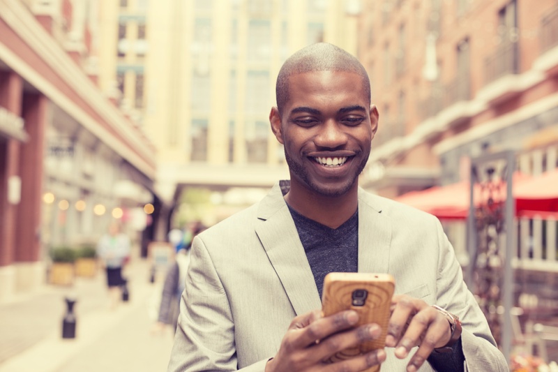 Black Man Smiling Using Smartphone Wood Case