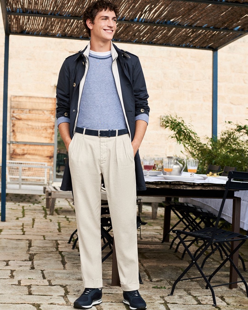 All smiles, Jaka Mojskerc sports a raincoat for Canali's spring-summer 2020 campaign.