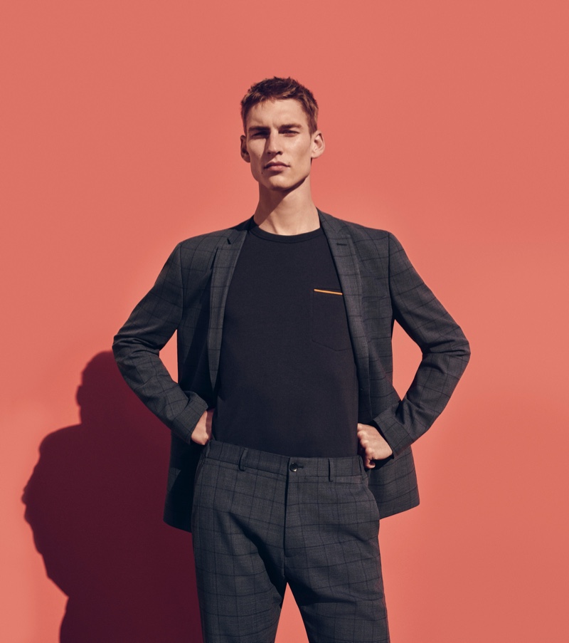 Model Thom Voorintholt wears a windowpane print suit from ESPRIT's spring-summer 2020 collection.