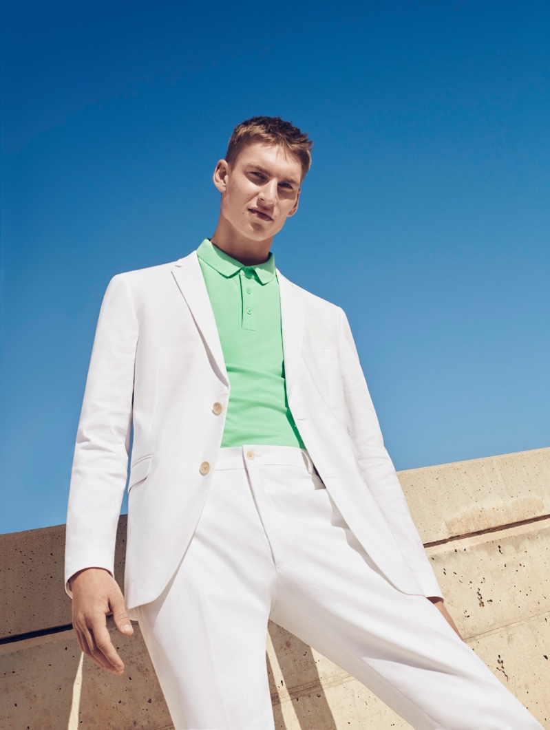 A fresh vision, Thom Voorintholt wears a lime green polo with a white suit by ESPRIT.