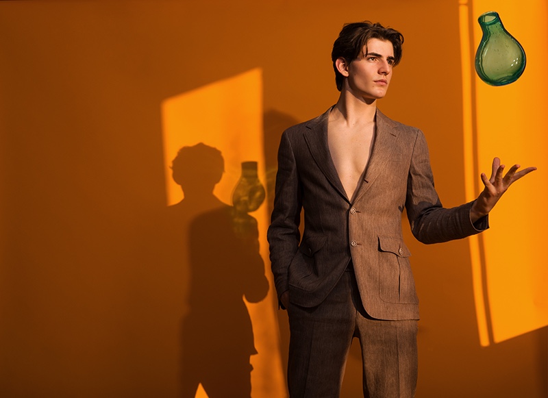Luca Haas dons a brown suit from Canali's spring-summer 2020 collection.
