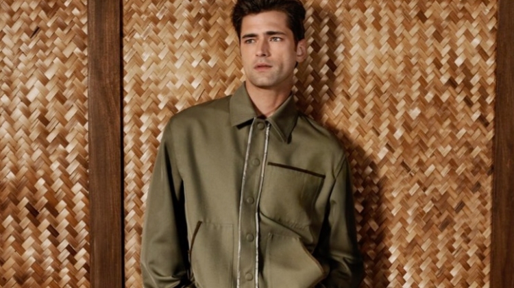 A casual vision, Sean O'Pry sports a twill jacket with denim and suede Bermuda shorts by Fendi for Holt Renfrew.