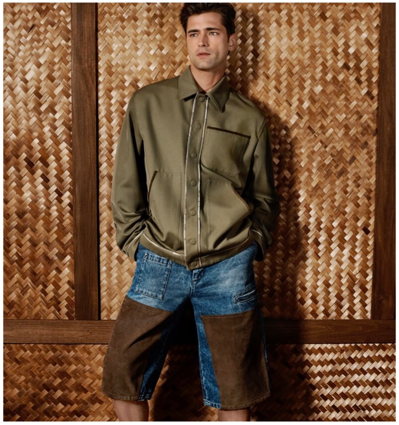 A casual vision, Sean O'Pry sports a twill jacket with denim and suede Bermuda shorts by Fendi for Holt Renfrew.