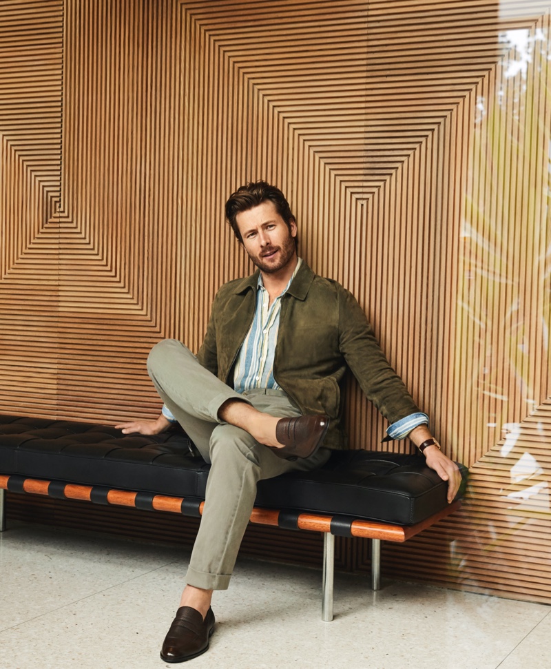 A smart vision, Glen Powell sports a Theory suede bomber jacket, NN07 striped shirt, Torino l'Opificio pants, and Bally loafers for Bloomingdale's spring 2020 Mix Masters campaign. 