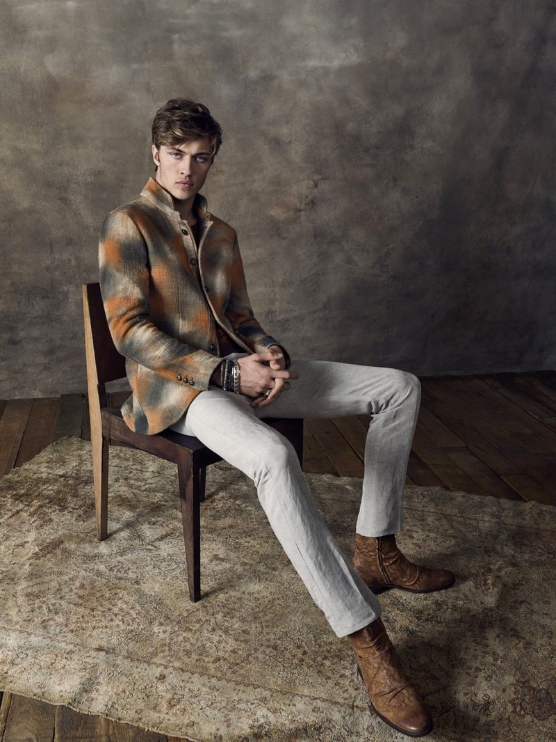 Lucky Blue Smith dons a checked jacket for John Varvatos' spring-summer 2020 campaign.