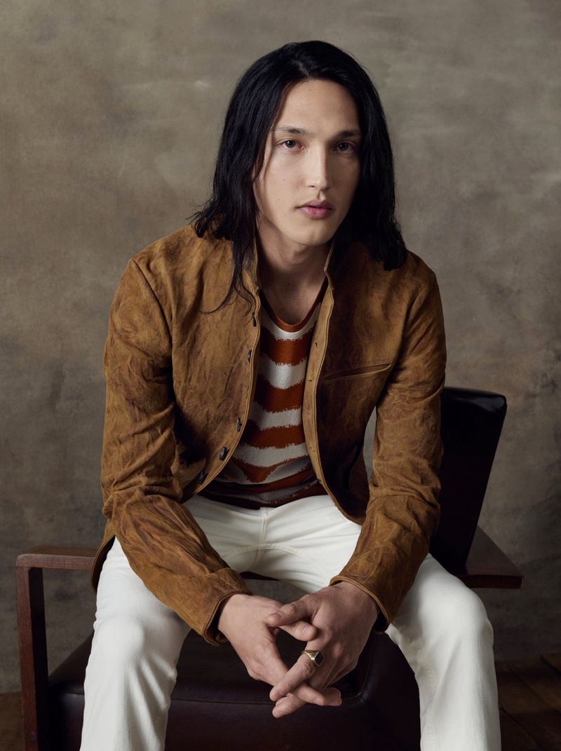 Joshua Smoot sports a suede jacket with light colored jeans for John Varvatos' spring-summer 2020 campaign.