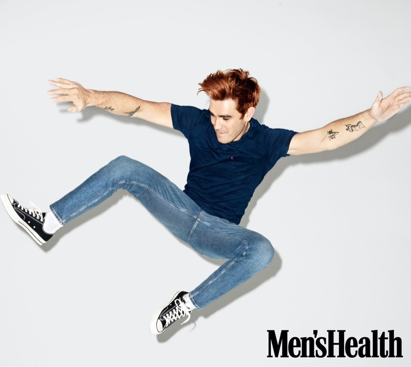 Captured mid-air, KJ Apa dons a pair of skinny-fit Everlane jeans with a Levi's t-shirt and Converse sneakers for Men's Health.