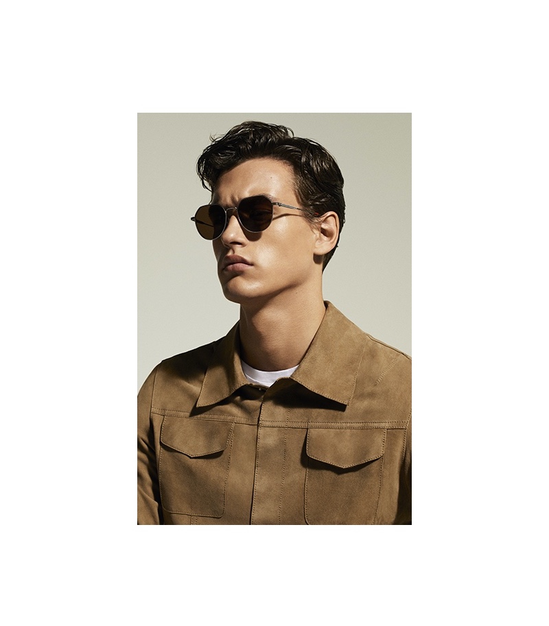 Sporting sunglasses and a brown suede jacket, Jegor Venned fronts Liu Jo Uomo's spring-summer 2020 campaign.