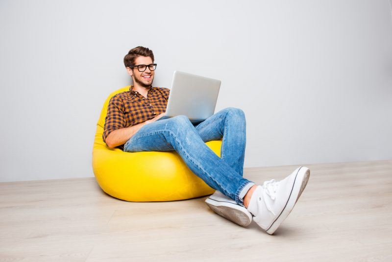 Man Wearing Glasses in White Sneakers