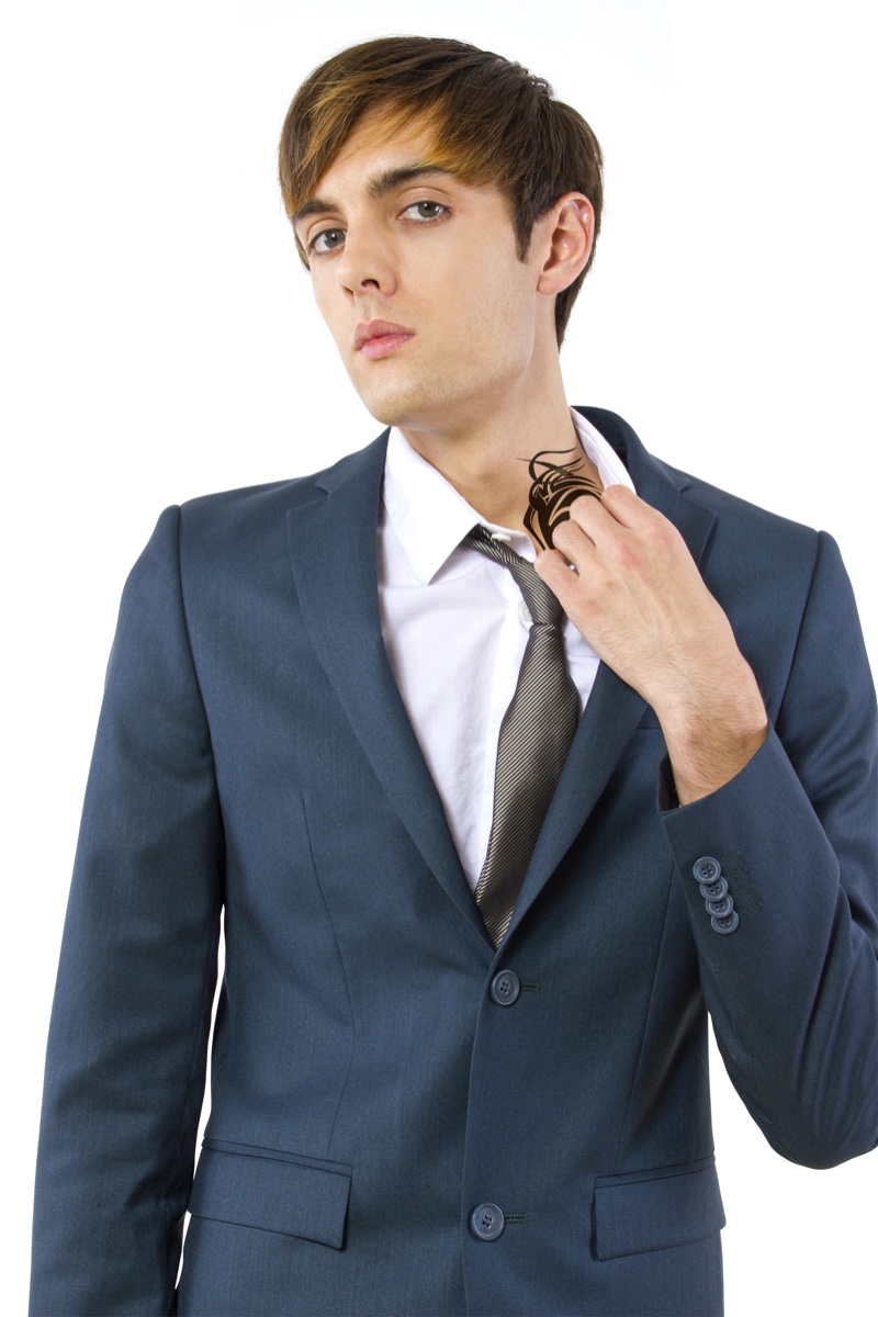 Man in Suit with Neck Tattoo Closeup