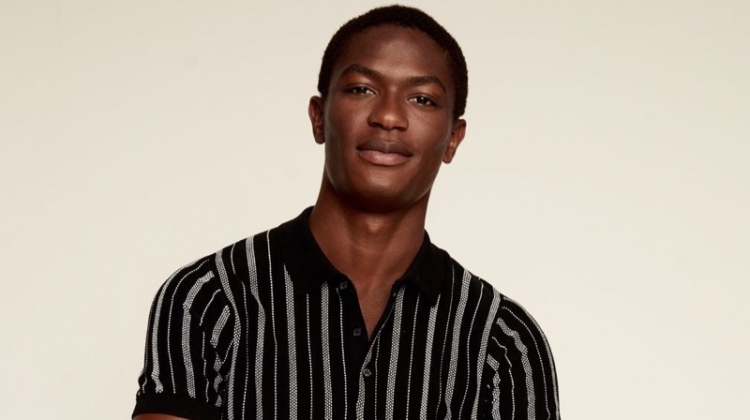 Reuniting with Mango, Hamid Onifade models a striped knit polo.