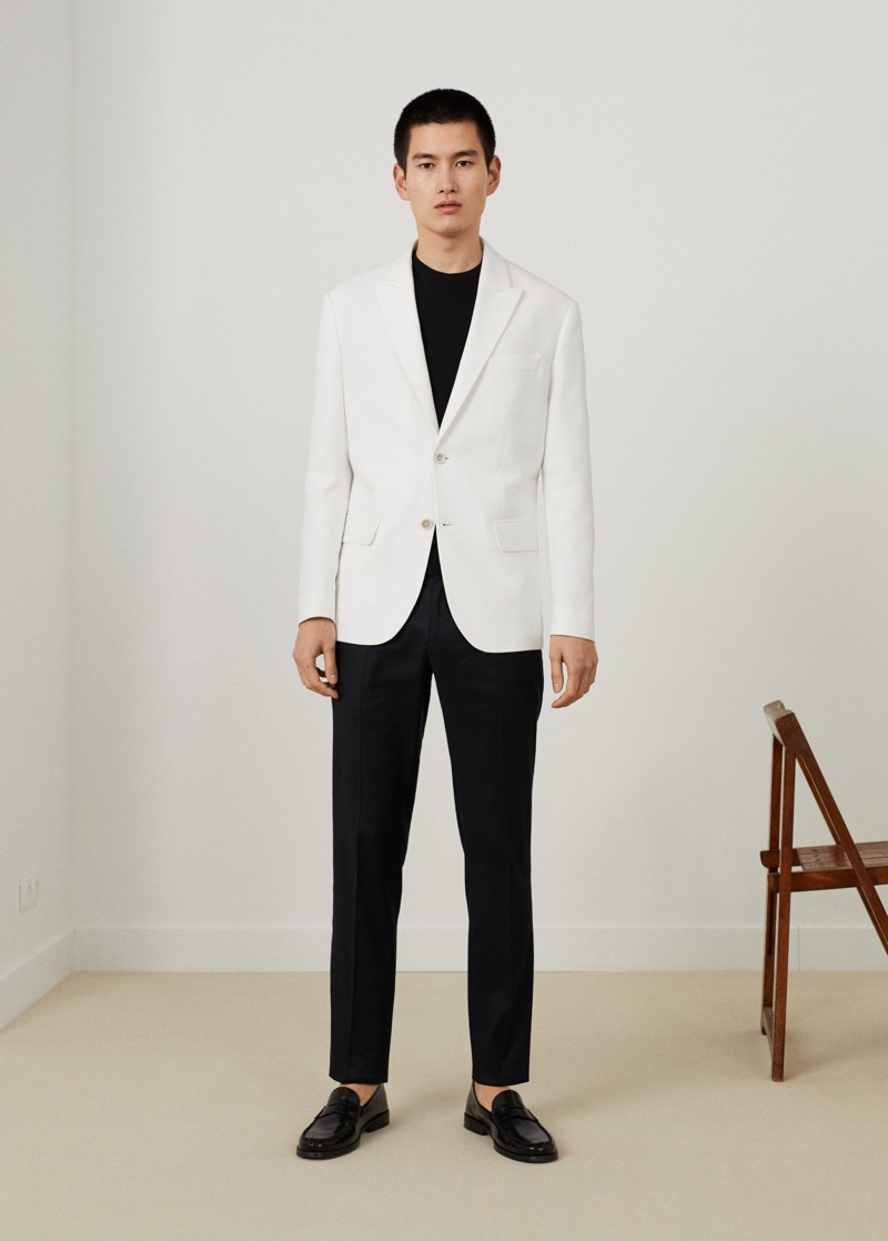 A sharp vision, Kohei Takabatake sports a white suit jacket with black pieces from Mango.