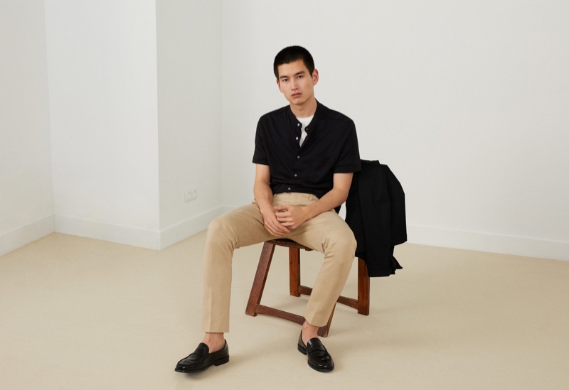 Kohei Takabatake dons a smart black shirt with chinos from Mango.