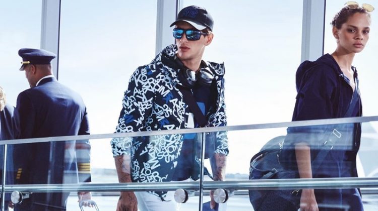 Navigating his way through the airport, Austin Augie appears in Michael Kors' spring-summer 2020 campaign.