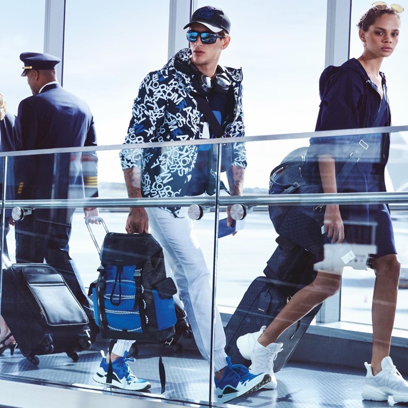 Navigating his way through the airport, Austin Augie appears in Michael Kors' spring-summer 2020 campaign.