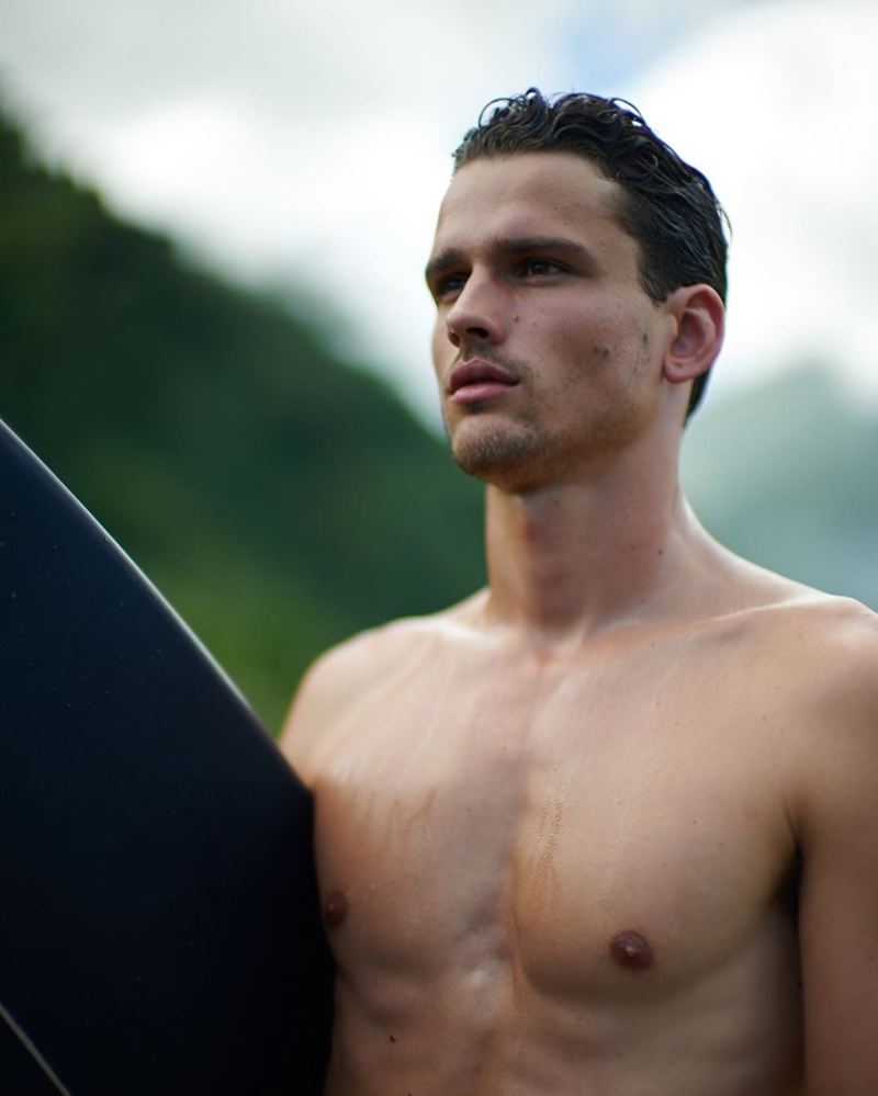 A shirtless Simon Nessman is the face of Ralph Lauren fragrance POLO Deep Blue.