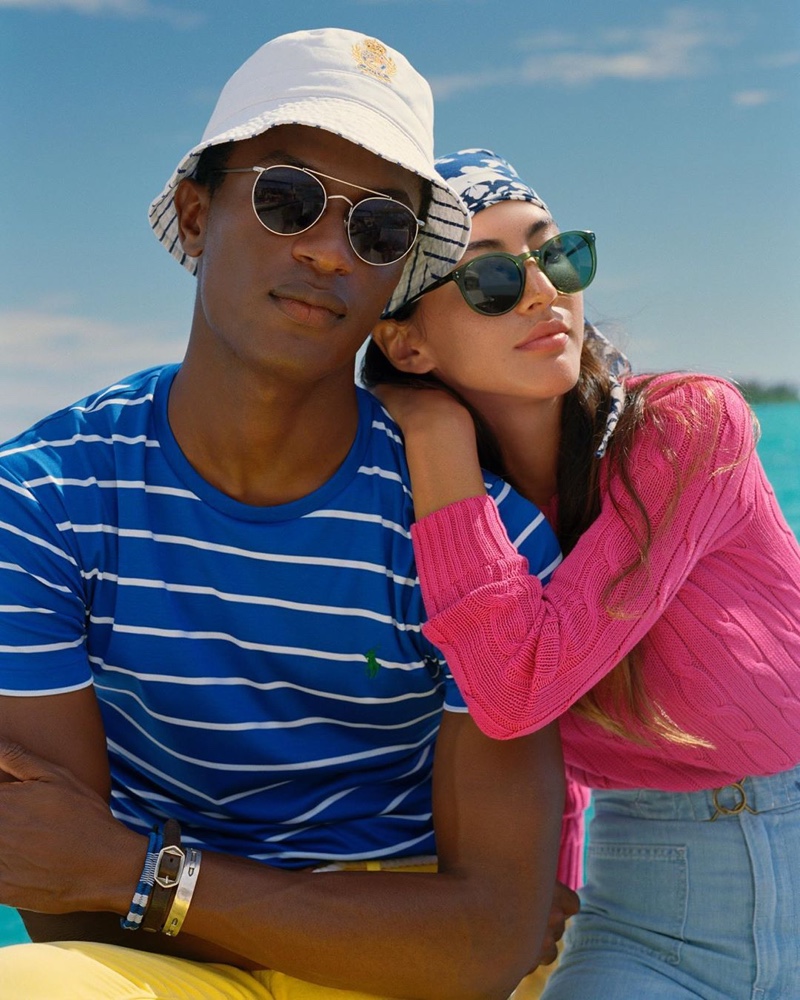 A summer vision, Hamid Onifade rocks shades with a striped tee and yellow pants from POLO Ralph Lauren.