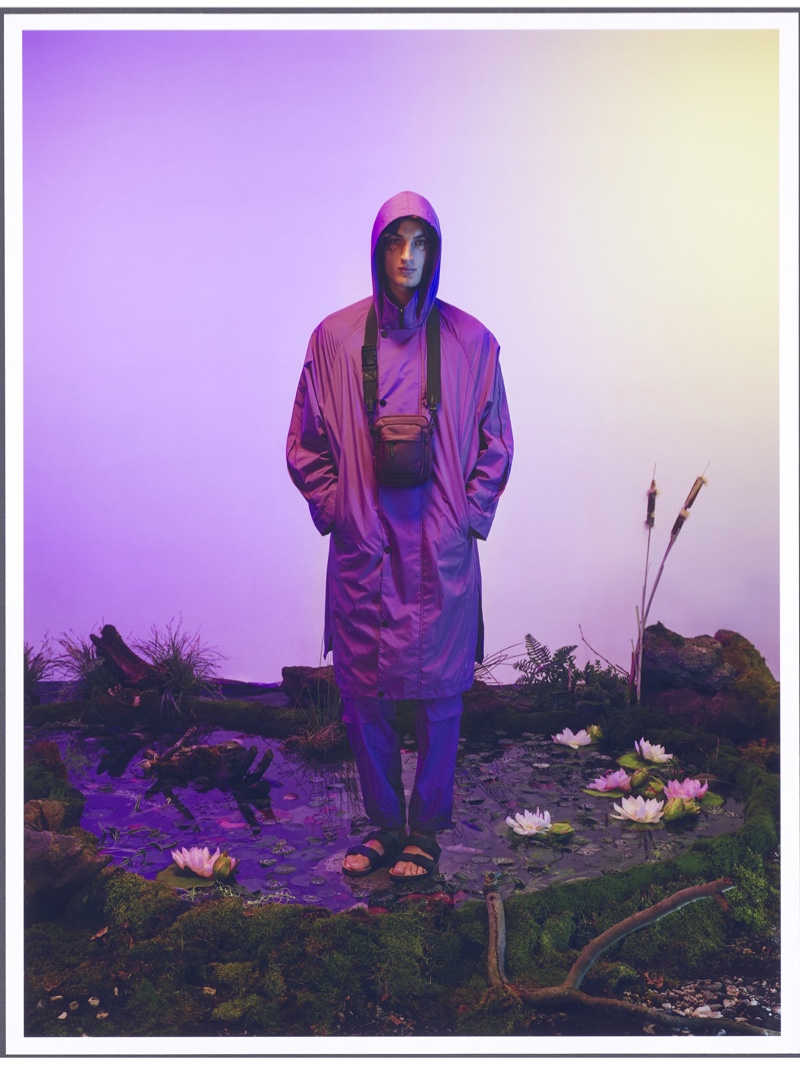 Front and center, Aaron Shandel models a purple waterproof coat from Reserved's Re Design collection.