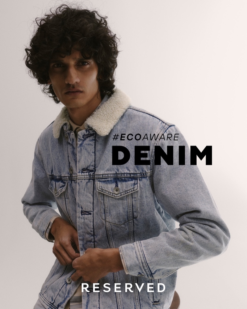 Connecting with Reserved, Mustafa Dawood wears a denim trucker jacket.