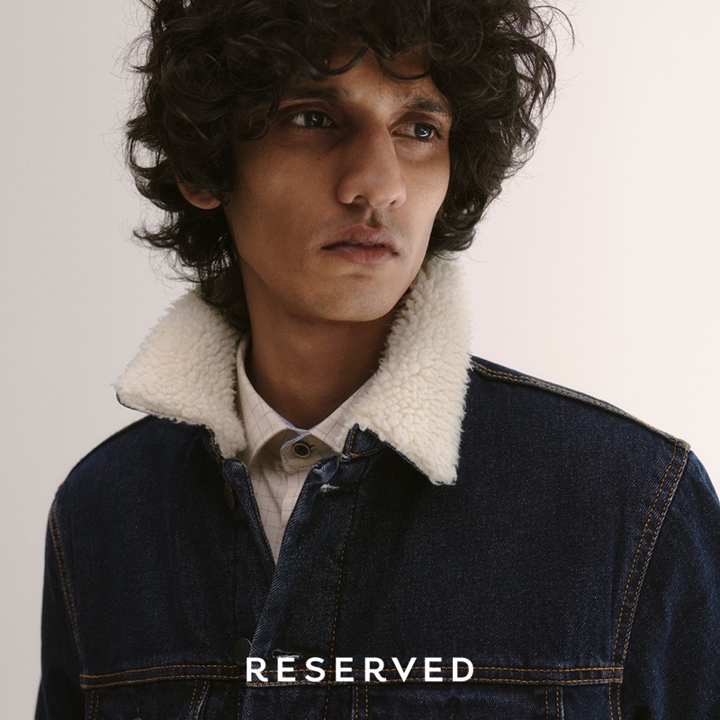 Sporting a denim trucker jacket, Mustafa Dawood models for Reserved.