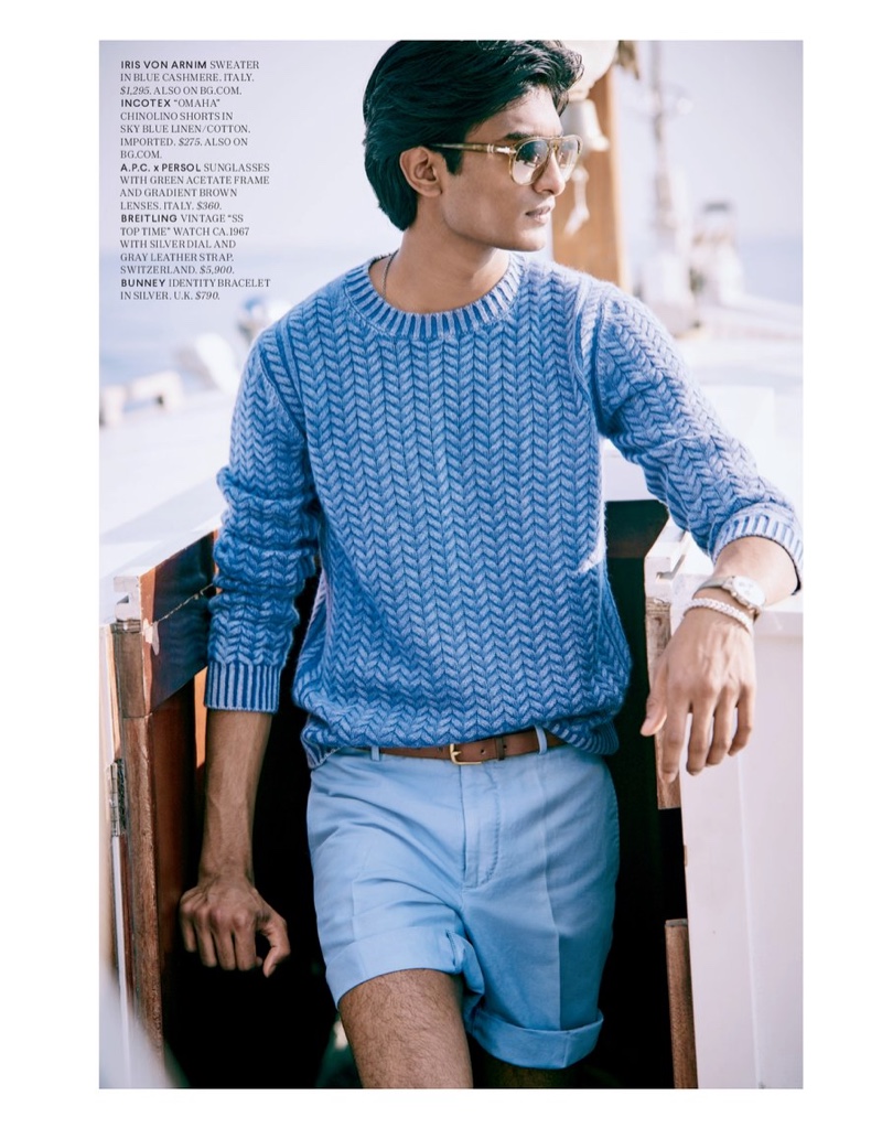 Embracing shades of blue, Rishi Robin models an Iris von Arnim sweater with Incotex chino shorts, and A.P.C. x Persol sunglasses for Bergdorf Goodman.