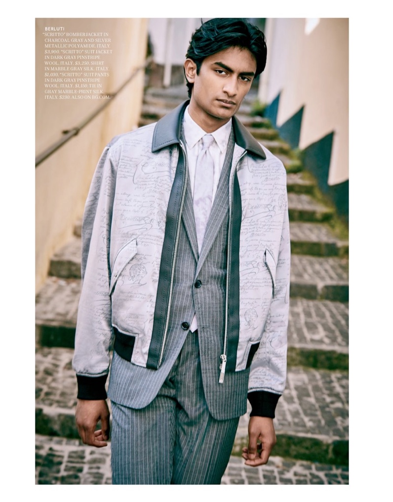 Championing shades of grey, Rishi Robin models fashions from Berluti for Bergdorf Goodman.