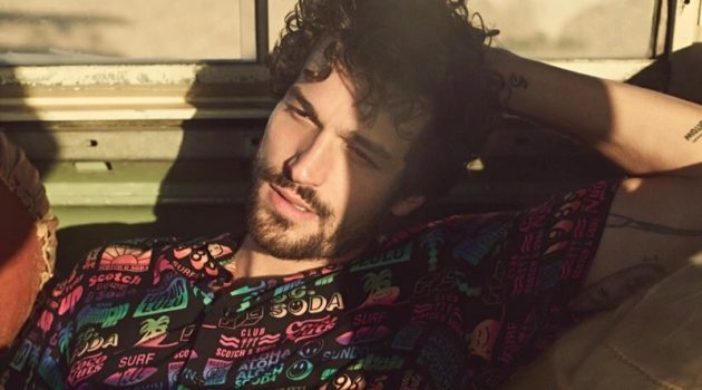 Paul Takes a Road Trip for Scotch & Soda Spring '20 Campaign Enjoying a warm day's sun, Paul Kelly appears in Scotch & Soda's spring-summer 2020 campaign. He relaxes in the brand's printed viscose shirt.
