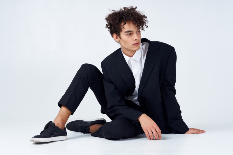 Stylish Young Male in Suit and Sneakers Stylish Young Male in Suit and Sneakers