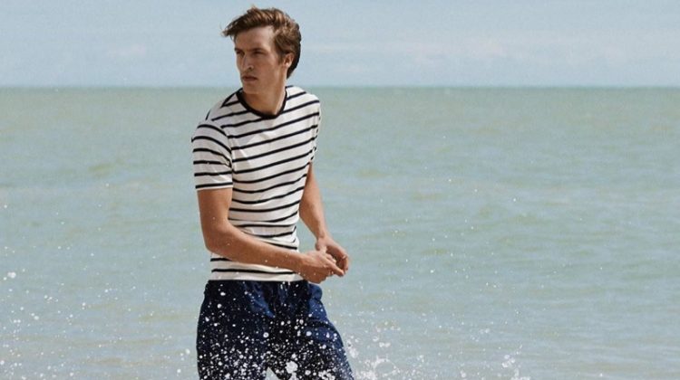 Taking to the beach, Tim Dibble appears in Sunspel's spring-summer 2020 campaign.