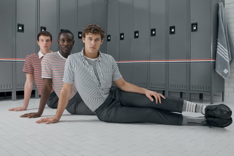 Hitting the locker room, Rocky Harwood, Charles Oduro, and Conor Fay sport striped shirts from the Thom Browne x Nordstrom Concepts 009 collection.