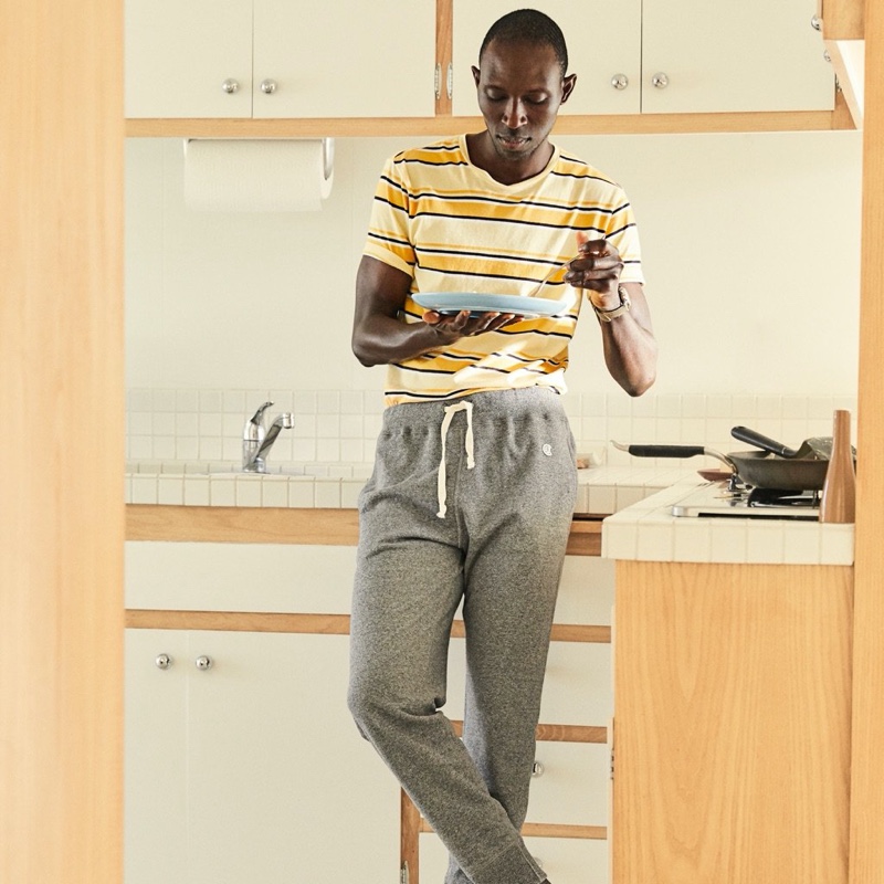 Front and center, Armando Cabral wears a Todd Snyder Portuguese striped tee with Todd Snyder + Champion jogger sweatpants.