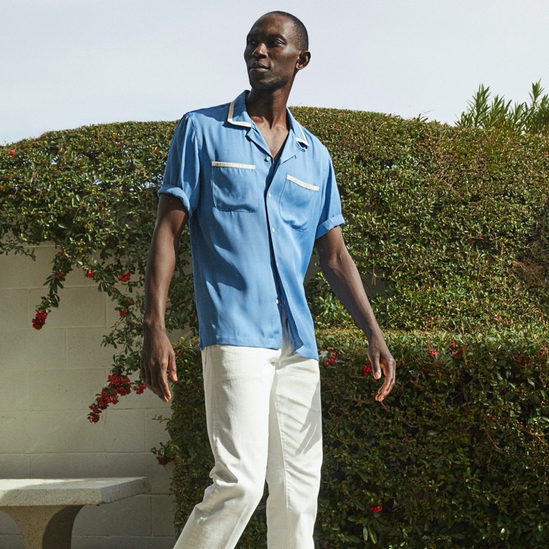 Model Armando Cabral rocks a Todd Snyder tipped bowling shirt in blue.