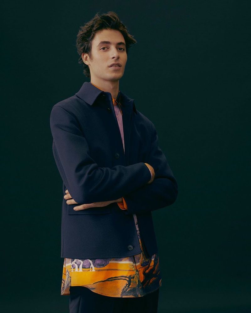 Front and center, Oscar Kindelan sports a Valentino silk city print shirt with a wool and cashmere-blend jacket from Mytheresa.