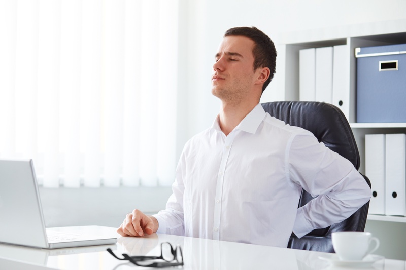 Young Man Back Pain Office Desk