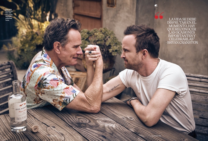 Arm wrestling, Bryan Cranston and Aaron Paul appear in a photo shoot for Esquire México. Cranston wears a SSS World Corp shirt while Paul dons a Levi's t-shirt with Todd Snyder pants.