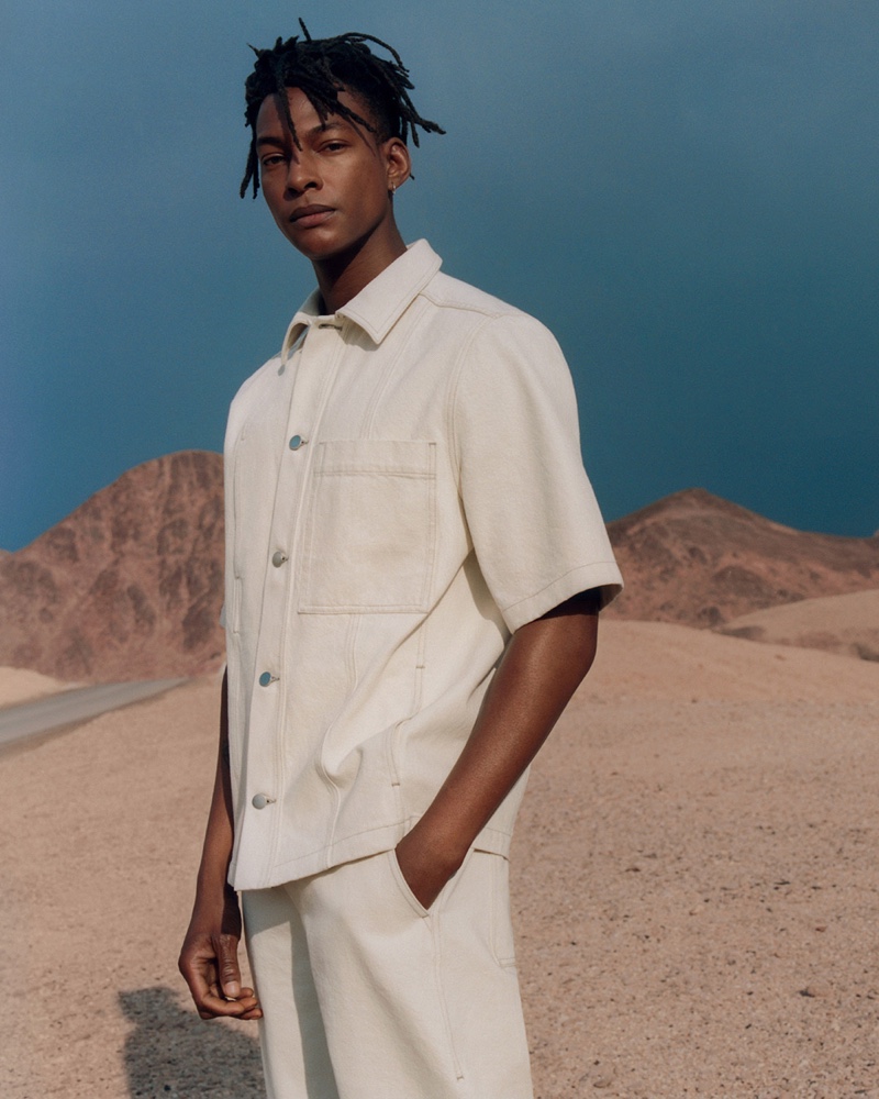 Ty Ogunkoya wears a short-sleeve denim shirt with matching pants from COS.